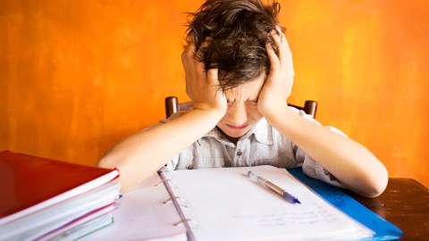 A boy struggles with homework, which appears to be an ADHD issue but may actually be OCD.