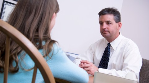A doctor discussing anxiety with a young child