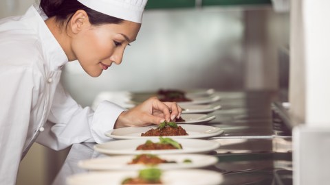 Chef Alexis Hernández prepares a dish while explaining why culinary school is ideal for creative adults with ADHD.