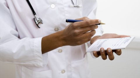 Doctor writing prescription for ADHD