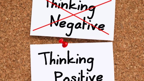 The words "thinking negative" crossed out by someone diagnosed with ADHD