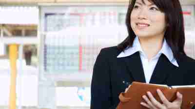 A businesswoman schedules meetings ahead of time to allow her to keep track of everything and plan accordingly, helping her manage her ADHD in the workplace.
