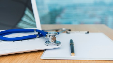 Doctor's laptop and stethoscope, important tools for accurate diagnoses.