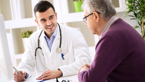 Doctor explaining the side effects of ADHD medications to his senior patient