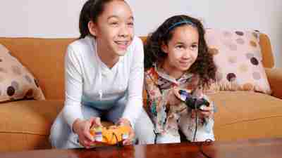 Two teens with ADHD play video games together