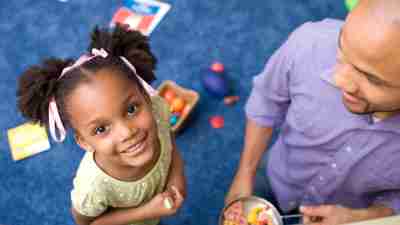 What is ASD? A girl with autism plays with her father