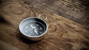 Compass on wooden table representing the different directions an ADHD person can take with their career